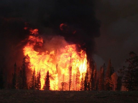 Orange flames boil up. Photo by Kenna Tanner.