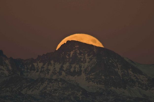 Moon behind Jackson Pk. Photo by Dave Bell.