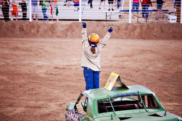 A wave to the crowd. Photo by Tara Bolgiano, Blushing Crow Photography.