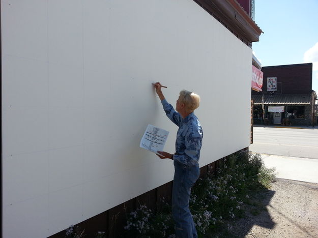 Starting the mural. Photo by Gina Feltner.