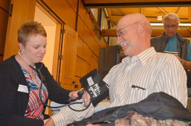 Councilman Jim Brost Gets his Blood Pressure Checked. Photo by Terry Allen.