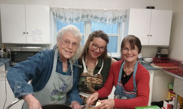 Cooks in the Kitchen. Photo by Jocelyn Moore.