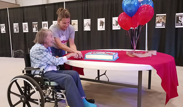 Cutting the Centennial cake. Photo by Clint Gilchrist.