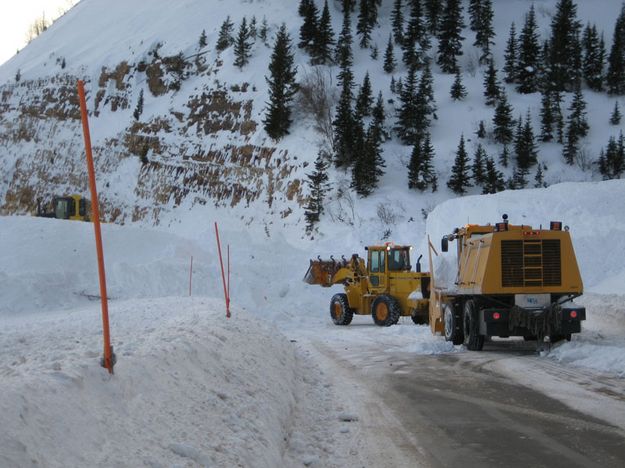 Snow taller than the trucks. Photo by Ed Smith, WYDOT.