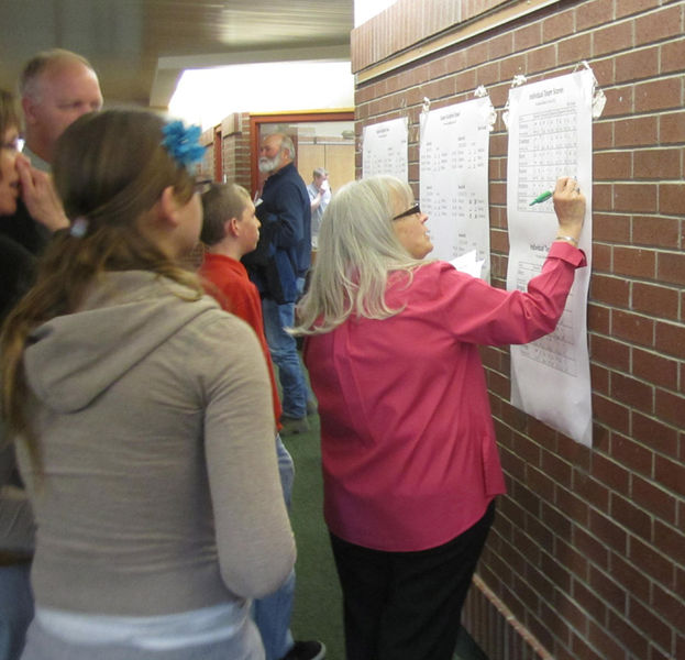 Posting scores. Photo by Bill Winney.