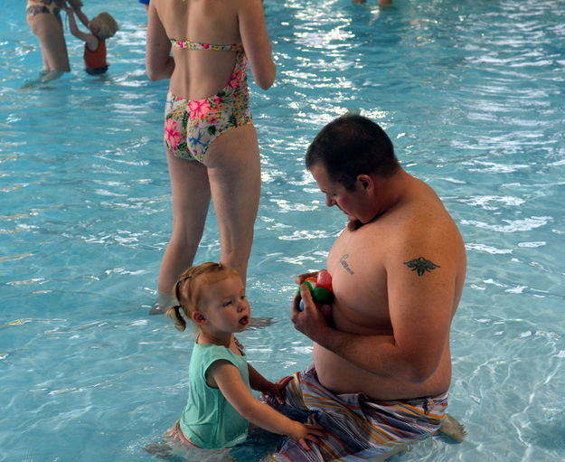 Dad and Daughter Count Eggs. Photo by Terry Allen.