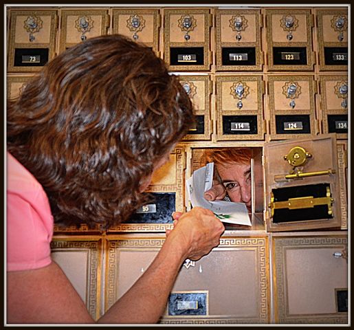 Maria Places Mail in Judy's Box. Photo by Terry Allen.