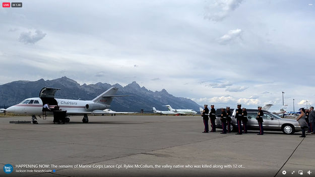 Bringing casket out. Photo by Jackson Hole News & Guide.